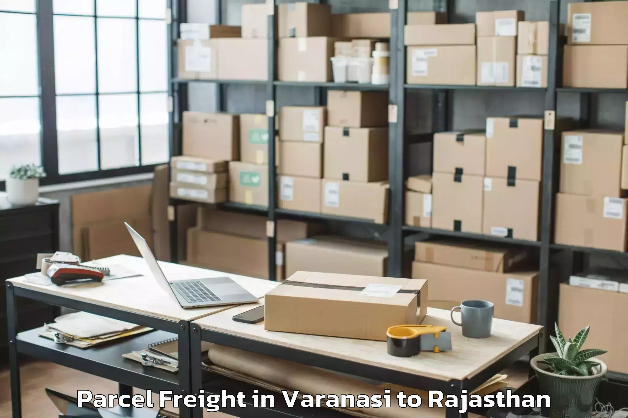 Book Varanasi to Pilibangan Parcel Freight Online